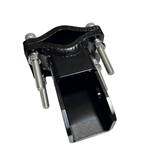 Black metal pipe clamp with four bolts.