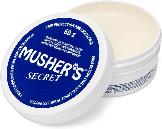 A white container with a blue lid for Musher's Secret Paw Protection wax.